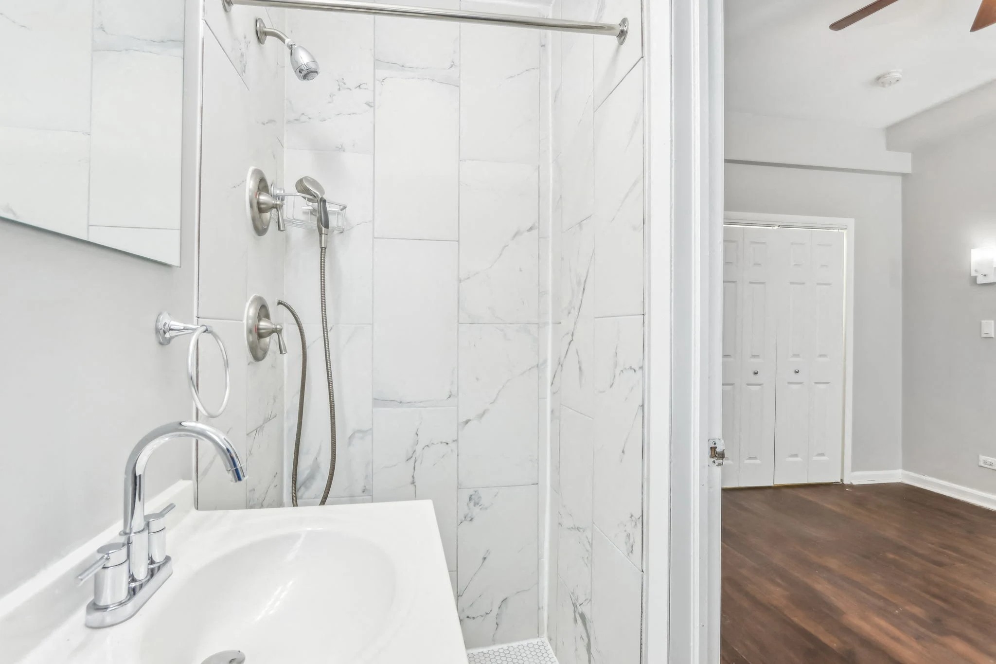 Bathroom with tiled shower at The Oliver on LaSalle