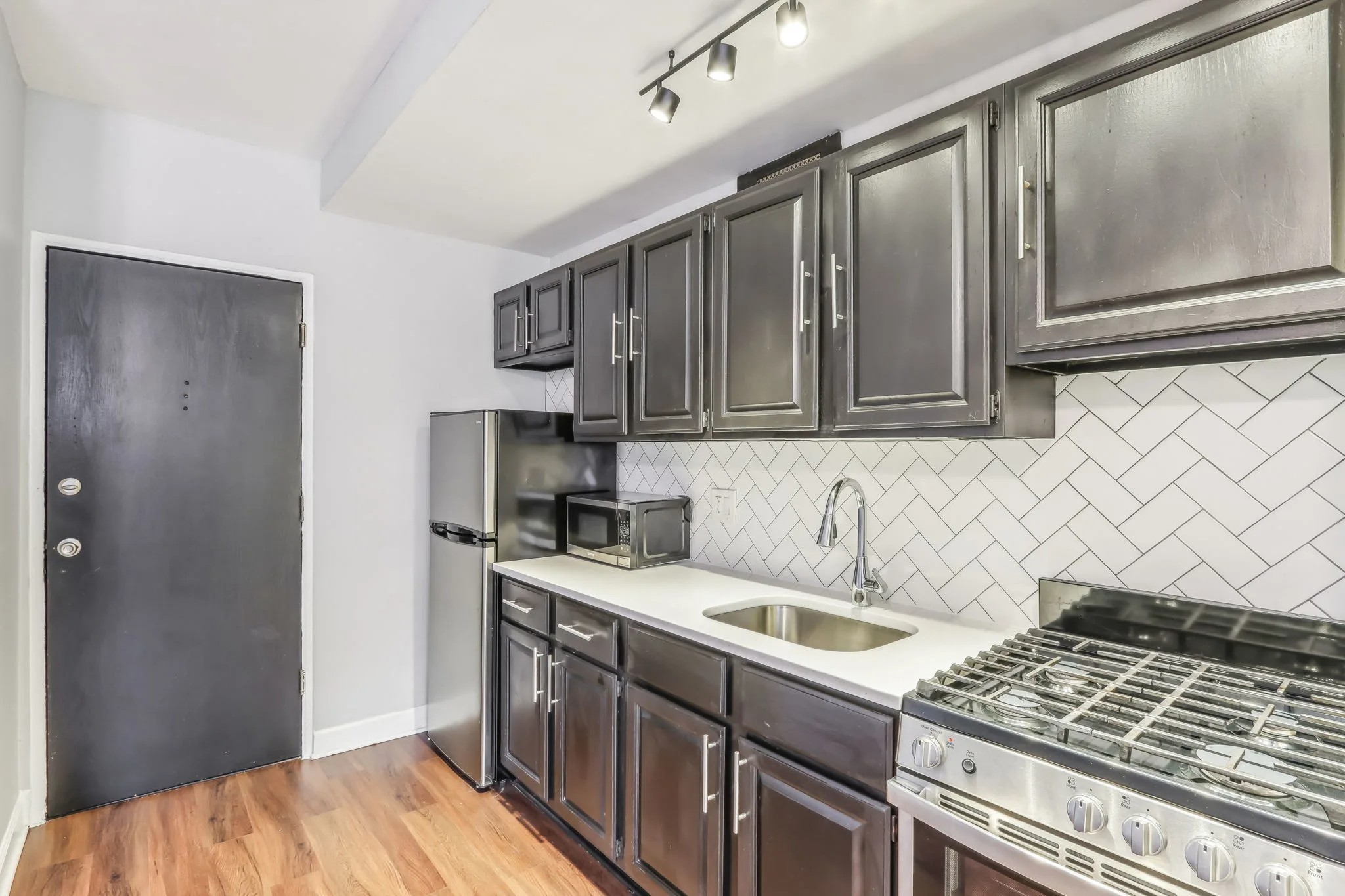 Kitchen with gas range at The Oliver on LaSalle