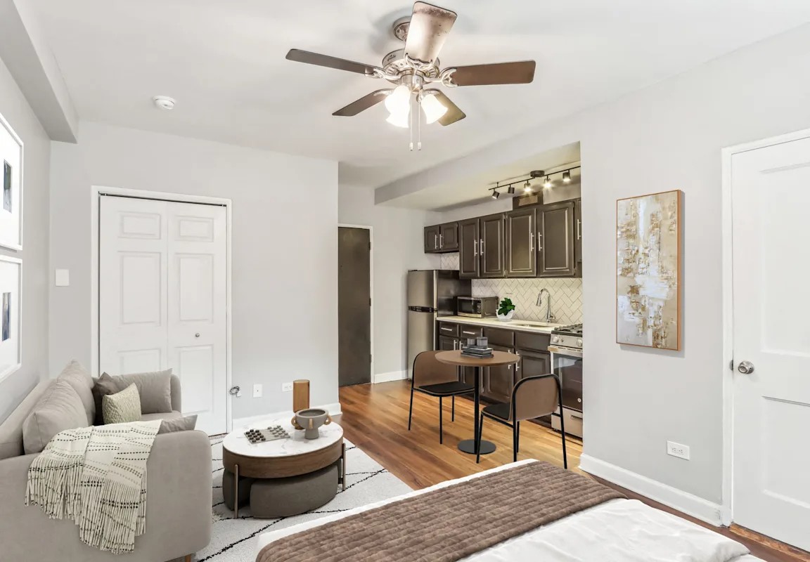 Living room and open kitchen in an apartment at The Oliver on LaSalle
