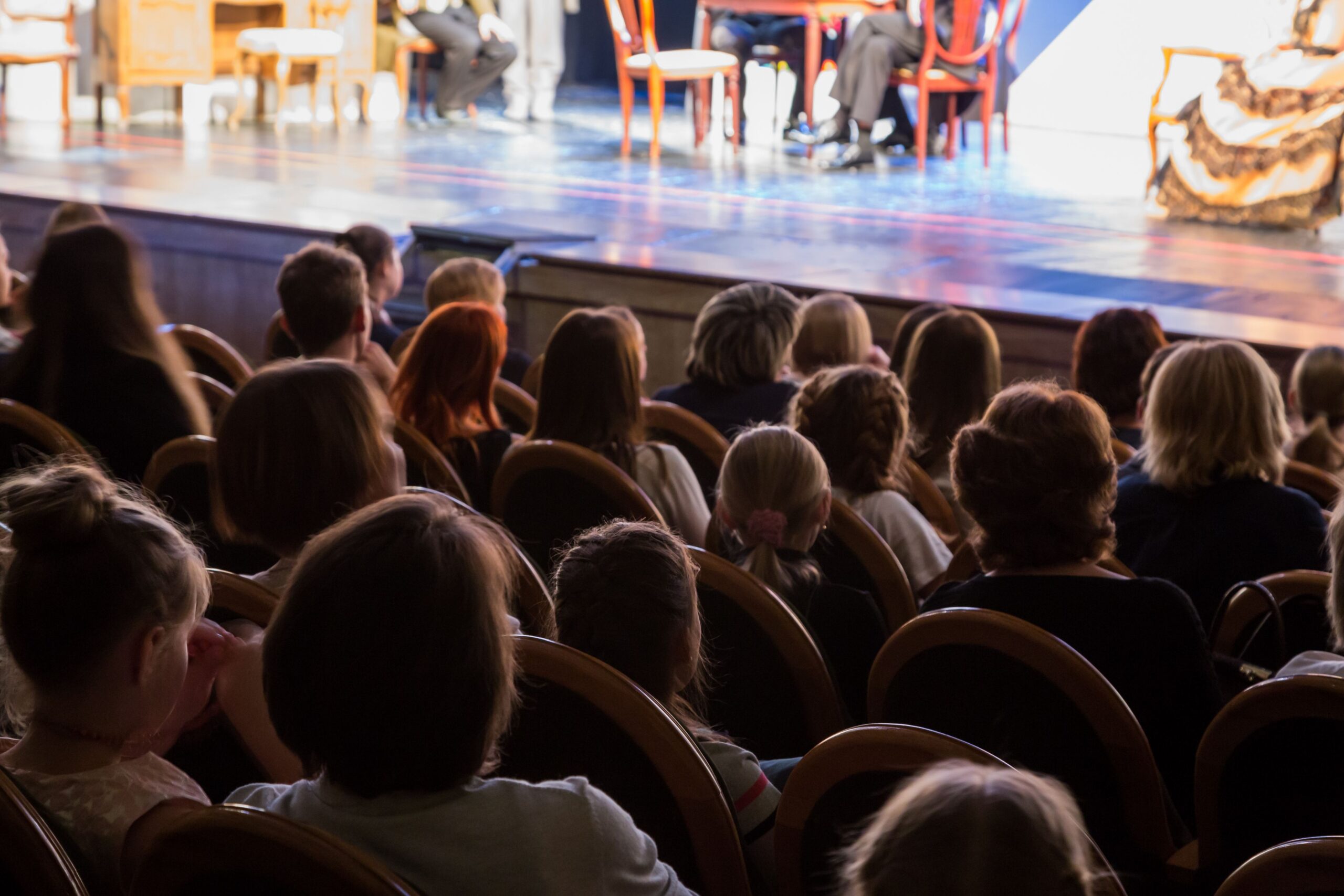 audience viewing live theater performance scaled